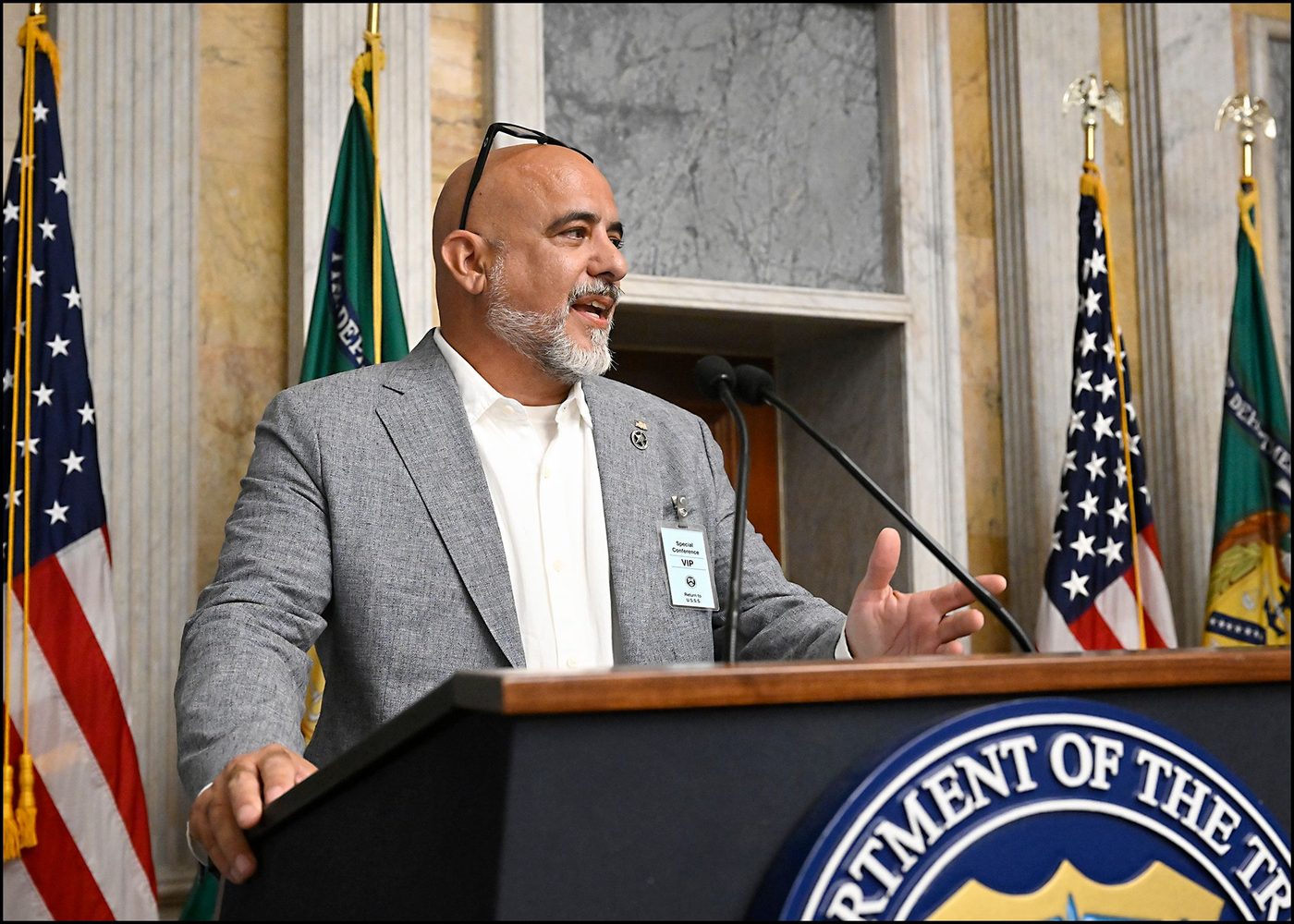 Tony Arcadi speaking at his Treasury retirement ceremony